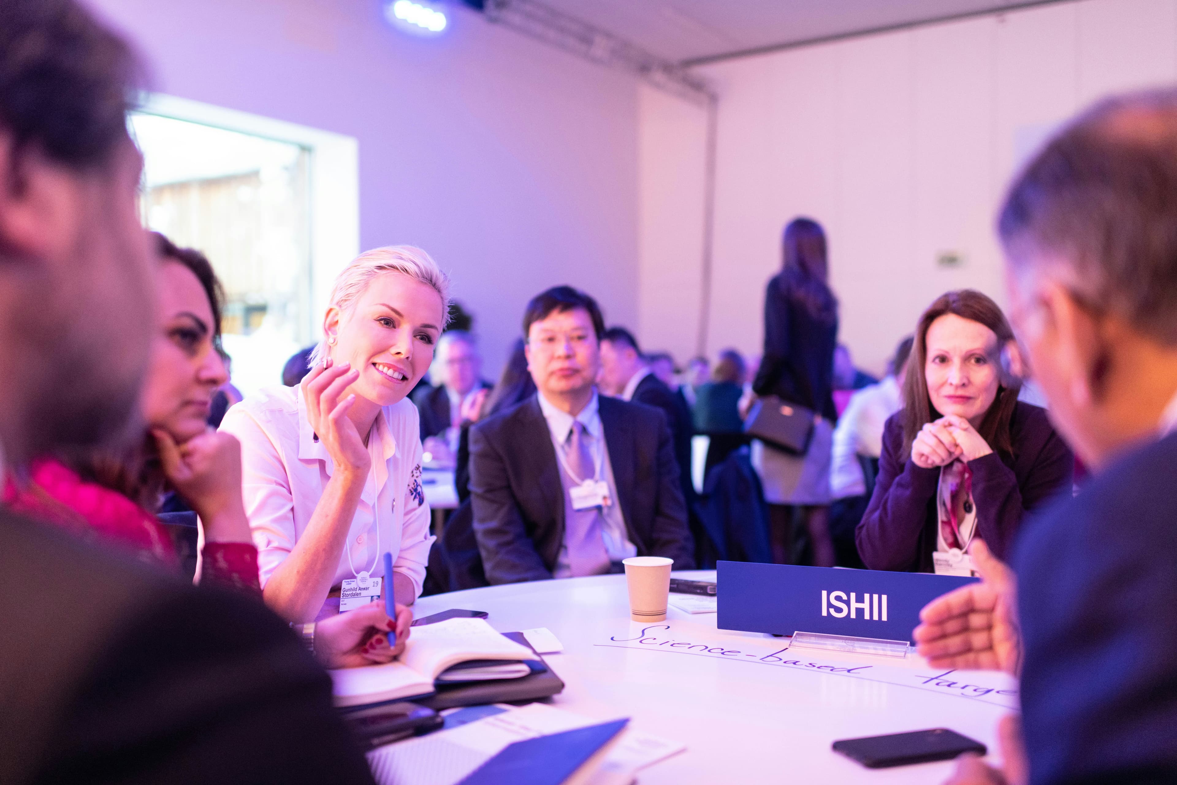 Members in discussion around a table